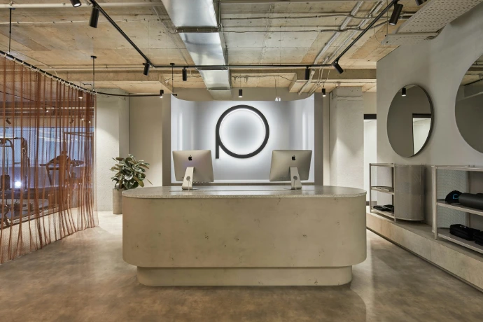 Modern reception desk with minimalist decor and logo